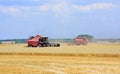 Combine harvesters working in the field