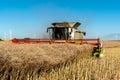 Combine harvesting the colza