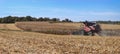 Combine harvesting a corn field in Northern Illinois beautiful farm field panorama