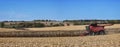 Combine harvesting a corn field in Northern Illinois beautiful farm field panorama Royalty Free Stock Photo