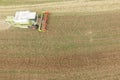 Combine harvesting a fall corn field Royalty Free Stock Photo