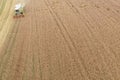 Combine harvesting a fall corn field Royalty Free Stock Photo