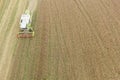 Combine harvesting a fall corn field Royalty Free Stock Photo