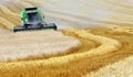 Combine harvesting wheat Royalty Free Stock Photo