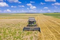 Combine harvesting wheat field Royalty Free Stock Photo