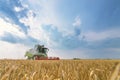 Combine harvesting a wheat field. Combine working the field Royalty Free Stock Photo