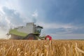 Combine harvesting a wheat field. Combine working the field Royalty Free Stock Photo