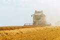 Combine harvesting a wheat field. Combine working the field Royalty Free Stock Photo