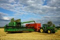 Combine machine and tractor with trailer Royalty Free Stock Photo