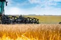 Combine mower for harvesting wheat.