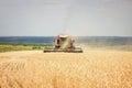 Combine mows wheat field, harvest Royalty Free Stock Photo