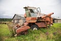 Old grain harvester in the field Royalty Free Stock Photo