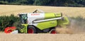 Combined Harvester in a wheat field. Royalty Free Stock Photo