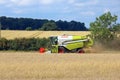 Combined Harvester in a wheat field. Royalty Free Stock Photo