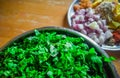 Combined indian spices and ingredients for making spinach curry ( indian cuisine ) with wooden background