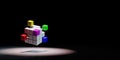 Combining Multicolor Cubes Spotlighted on Black Background