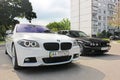 Kharkov, Ukraine. September, 2017; Combo BMW. Two BMW M5 - black and white. BMW M5 F10 and M5 E34 in the city Royalty Free Stock Photo