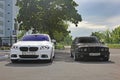 Kharkov, Ukraine. September, 2017; Combo BMW. Two BMW M5 - black and white. BMW M5 F10 and M5 E34 in the city Royalty Free Stock Photo