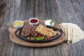 Combo Fajita; top down photo of mexican steak and chicken fajitas in iron skillet with corn tortillas Royalty Free Stock Photo