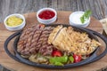 Combo Fajita; top down photo of mexican steak and chicken fajitas in iron skillet with corn tortillas Royalty Free Stock Photo