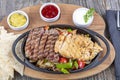 Combo Fajita; top down photo of mexican steak and chicken fajitas in iron skillet with corn tortillas Royalty Free Stock Photo