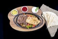 Combo Fajita; top down photo of mexican steak and chicken fajitas in iron skillet with corn tortillas Royalty Free Stock Photo