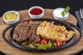 Combo Fajita; top down photo of mexican steak and chicken fajitas in iron skillet with corn tortillas Royalty Free Stock Photo