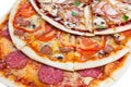 Combo with three different slices of pizzas Royalty Free Stock Photo