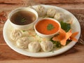 Combo of Veg steam momo and veg soup, Nepalese Traditional dish Momo stuffed with vegetables and then cooked and served with sauce