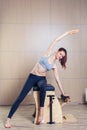 Combo wunda pilates chair woman fitness yoga gym Royalty Free Stock Photo