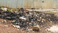 Combustion residue with trash on the ground