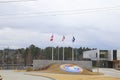 Comcast building and flags with a ground logo