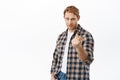 Come closer brave man. Sassy and confident handsome redhead man beckon to approach, flinch finger and lure someone Royalty Free Stock Photo