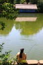 Woman fishing on the lake