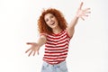 Come on free hugs. Charming friendly attractive curly redhead girl inviting cuddle stretch hands forward camera wanna