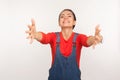 Come here, free hugs! Portrait of incredible amiable happy girl in denim overalls keeping hands wide open