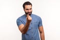 Come here. Handsome friendly man calling you with finger, looking at camera with playful expression, flirting and inviting on date Royalty Free Stock Photo