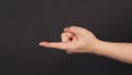 The Come Hither Hand Sign on black background.Use it when you want someone to come over Royalty Free Stock Photo