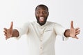 Come in my arms. Portrait of joyful friendly and happy handsome African American man with beard and short haircut