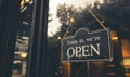 COME IN, WE ARE OPEN - Open sign broad hang on entrance door with copy space at coffee shop or restaurant Royalty Free Stock Photo