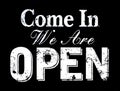 Come in we`re open, vintage black retro sign with the text in white color Royalty Free Stock Photo