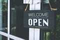 Come in we're open, vintage retro sign on cafe door Royalty Free Stock Photo