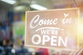 Come in we`re open, vintage retro sign in cafe front Royalty Free Stock Photo