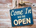 Come In We're Open on the wooden door, retro vintage style Royalty Free Stock Photo
