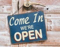 Come In We`re Open on the wooden door, retro vintage style Royalty Free Stock Photo