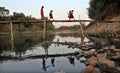 Come school, number of students crossing the bamboo bridge river river solo in the morning,