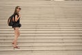 Come and see. Girl tourist stairs. Ready explore city. Woman sporty black outfit walking. Vacation and travel concept Royalty Free Stock Photo