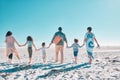 Come take a walk on the beach with us. a multi-generational family spending the day at the beach.