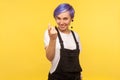 Come to me! Portrait of friendly cheerful hipster girl showing beckoning gesture. indoor studio shot