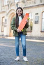 Come to skate and have fun. Happy kid hold penny board. Little skater urban outdoors. Board for transportation